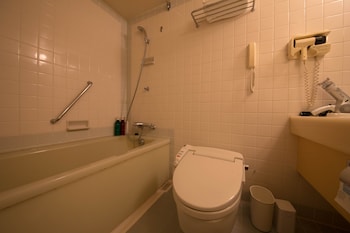 Separate tub and shower, free toiletries, hair dryer, slippers