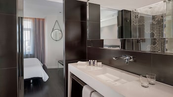 Suite, 1 Bedroom | Bathroom | Combined shower/tub, rainfall showerhead, designer toiletries