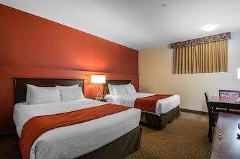 Standard Room, 2 Queen Beds (Basement) | In-room safe, desk, iron/ironing board, bed sheets