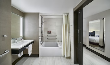 Shower, eco-friendly toiletries, hair dryer, towels