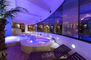 Indoor pool, outdoor pool, pool umbrellas, sun loungers