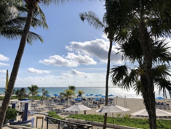 Private beach, white sand, sun loungers, beach umbrellas