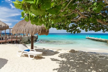 Private beach, white sand, sun loungers, beach umbrellas