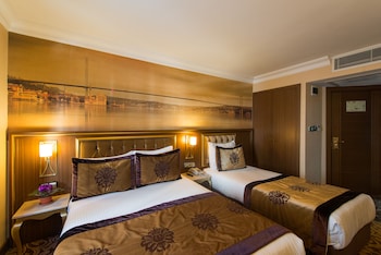 Triple room | Premium bedding, minibar, in-room safe, individually decorated