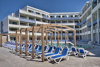 Indoor pool, seasonal outdoor pool, pool umbrellas, sun loungers