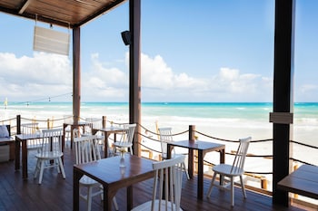 Breakfast, lunch, dinner served; Fusion cuisine, beach views 