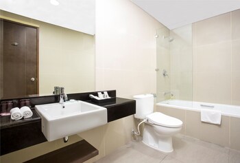 Executive Suite | Bathroom | Shower, slippers, towels