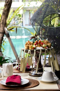 Breakfast, lunch, dinner served; international cuisine, pool views 