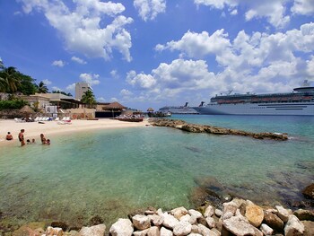 On the beach, free beach cabanas, sun loungers, beach towels