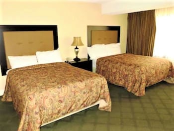 Deluxe Condo, 1 Bedroom | Desk, blackout drapes, iron/ironing board, bed sheets