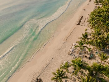 On the beach, white sand, free beach cabanas, sun loungers