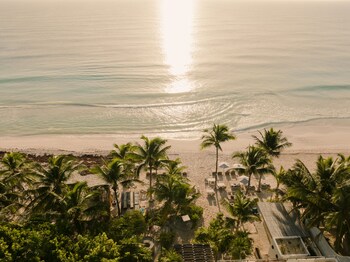 On the beach, white sand, free beach cabanas, sun loungers