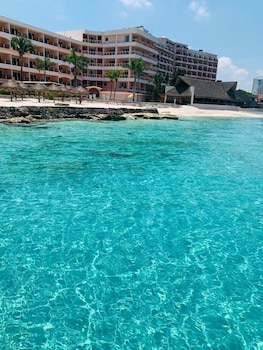 On the beach, white sand, free beach cabanas, sun loungers