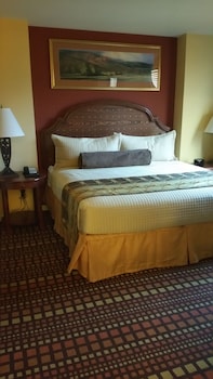 Suite, 1 Bedroom | In-room safe, blackout drapes, iron/ironing board, bed sheets