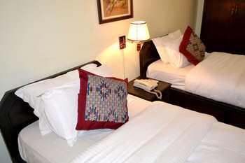 Premium bedding, down comforters, minibar, in-room safe