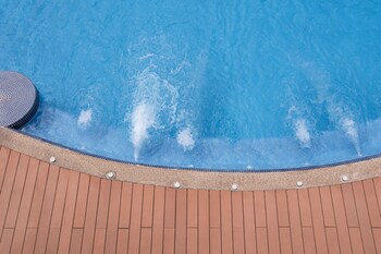 Outdoor pool, open 6 AM to 10 PM, sun loungers