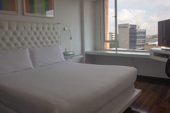 Deluxe Suite, 1 Bedroom, Bathtub, City View | Premium bedding, down comforters, pillowtop beds, minibar