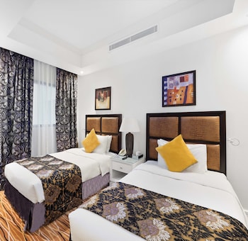 Executive Suite | Premium bedding, minibar, in-room safe, individually furnished