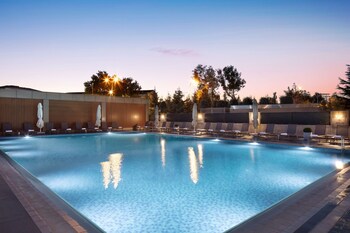 Indoor pool, seasonal outdoor pool, pool umbrellas, sun loungers