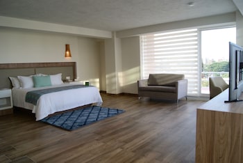 Suite, 1 King Bed | In-room safe, desk, iron/ironing board, free cribs/infant beds