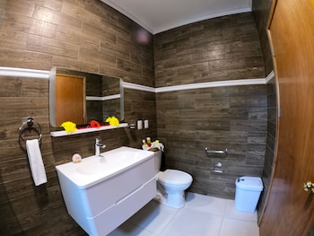 Junior Quadruple Room, 1 Bedroom | Bathroom | Shower, rainfall showerhead, free toiletries, hair dryer