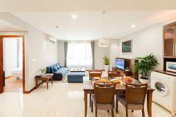 Family Apartment, 2 Bedrooms | Living area | 32-inch LCD TV with cable channels, TV, DVD player