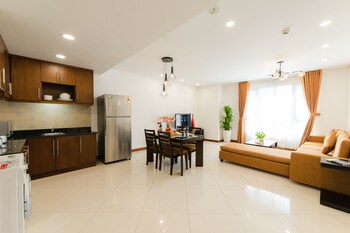 Family Apartment, 2 Bedrooms | Living area | 32-inch LCD TV with cable channels, TV, DVD player