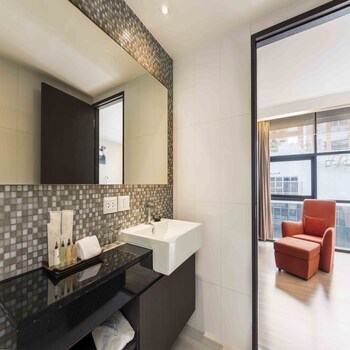 One Bedroom Deluxe | Bathroom | Eco-friendly toiletries, hair dryer, bathrobes, slippers