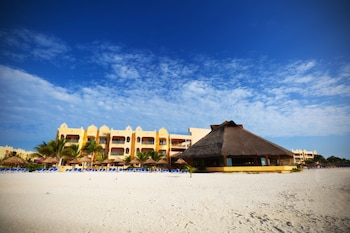 On the beach, white sand, sun loungers, beach umbrellas