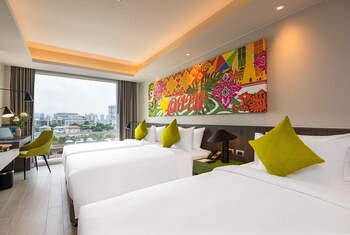 Deluxe Triple Room, City View | Minibar, in-room safe, desk, laptop workspace