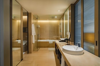 Premier Club, 1 King Bed | Bathroom | Separate tub and shower, deep soaking tub, rainfall showerhead