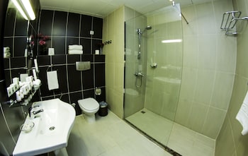 Executive Room, Sea View | Bathroom | Shower, designer toiletries, hair dryer, bathrobes