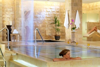 Spa tub, steam room, body treatments, aromatherapy, hot stone massages