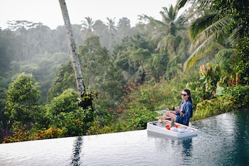 Breakfast, lunch, dinner served; Indonesian cuisine, pool views 