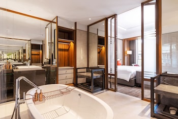 Separate tub and shower, jetted tub, hair dryer, bathrobes