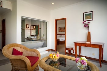 Royal Suite, Bathtub, Pool View | Living area | 32-inch LCD TV with digital channels, TV, books