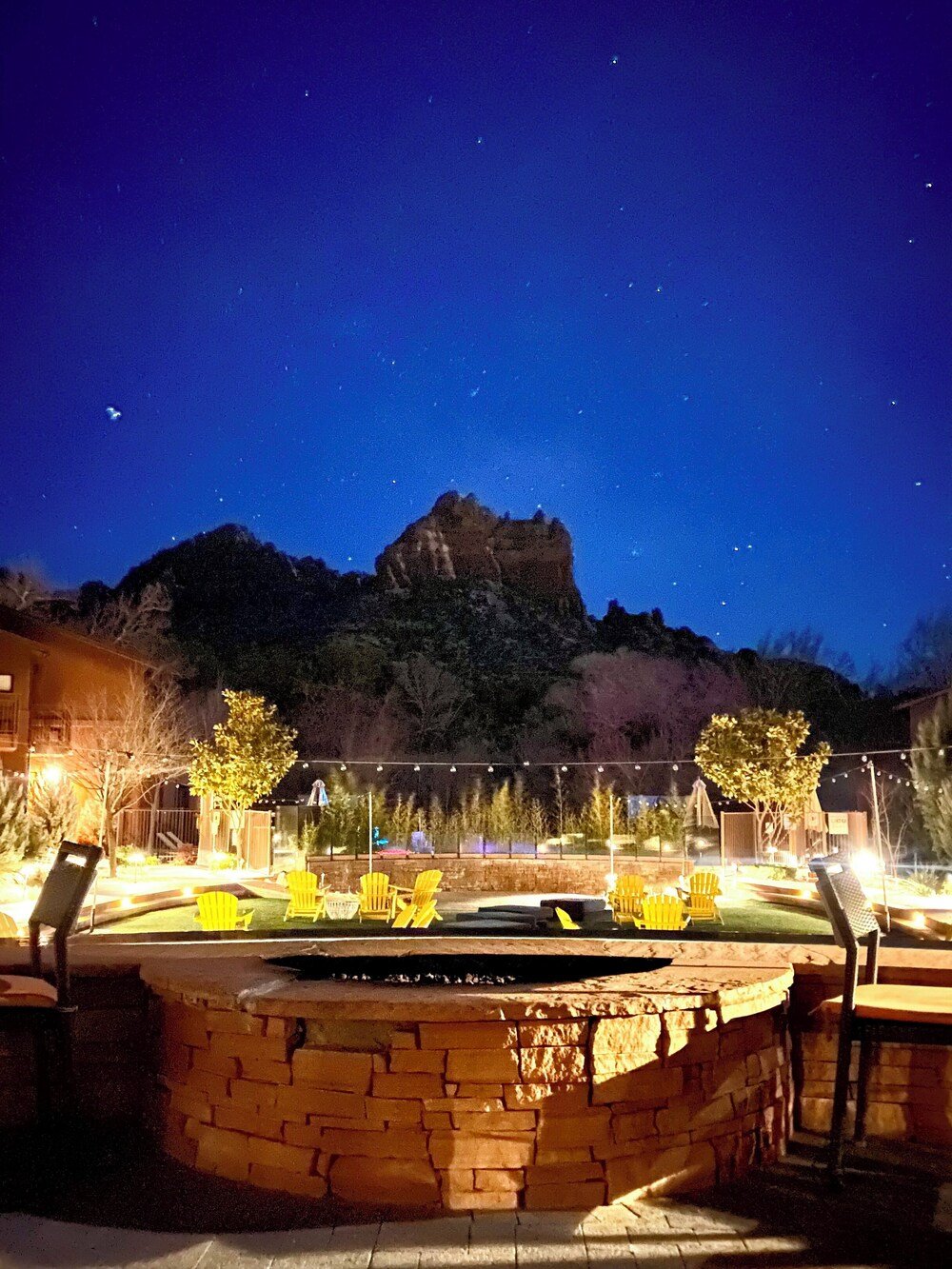 Patio with outdoor seating and a view of the red rock mountains
