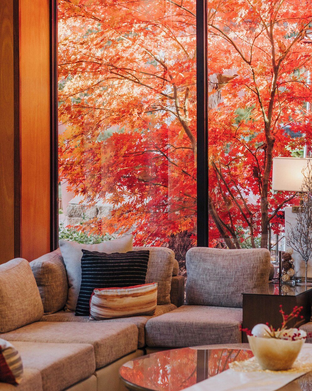 Modern living room with a large window in a resort suite