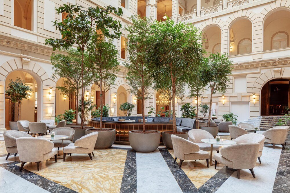 Large lobby with a central seating area at the Budapest palace hotel