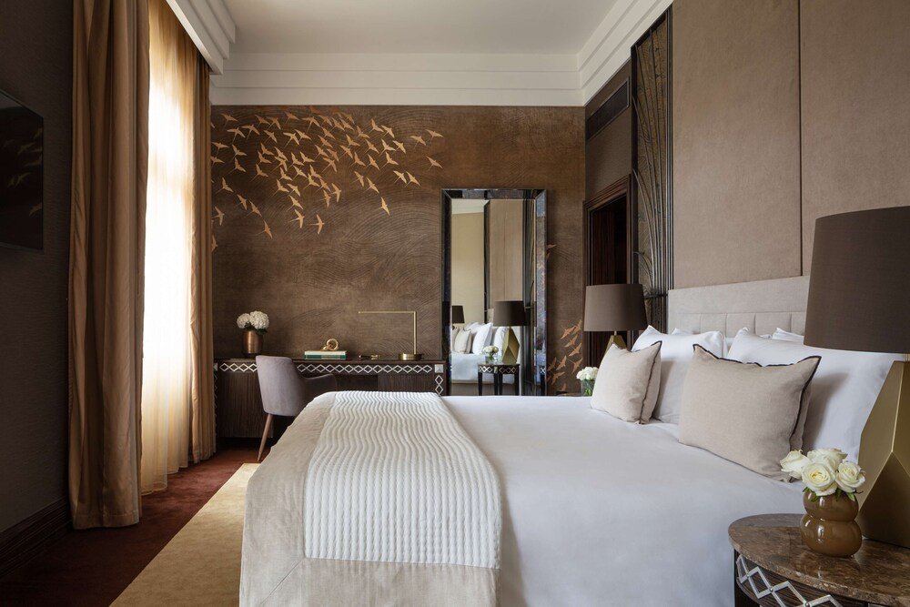 Hotel room with a large bed and a work desk