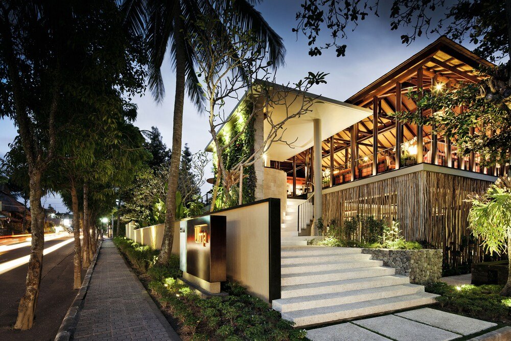 Modern resort building with a staircase leading to a covered entrance