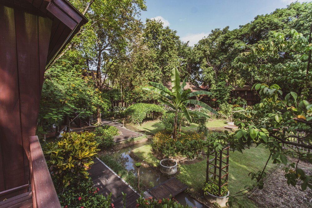 Garden view with trees and tropical vegetation at the resort