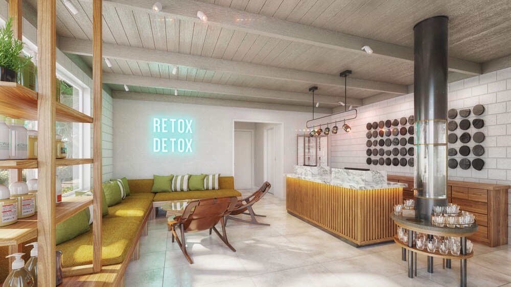 Modern interior with a sofa, wooden shelves and a neon sign