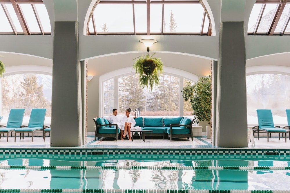 Pool area with seating and a hanging plant