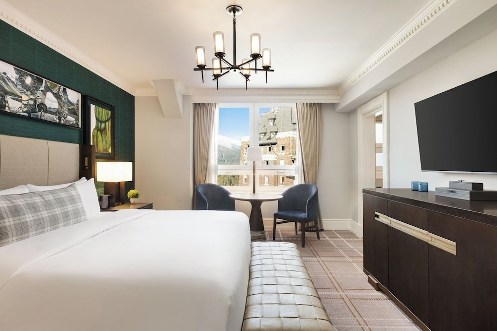 Hotel room with a large bed and a desk