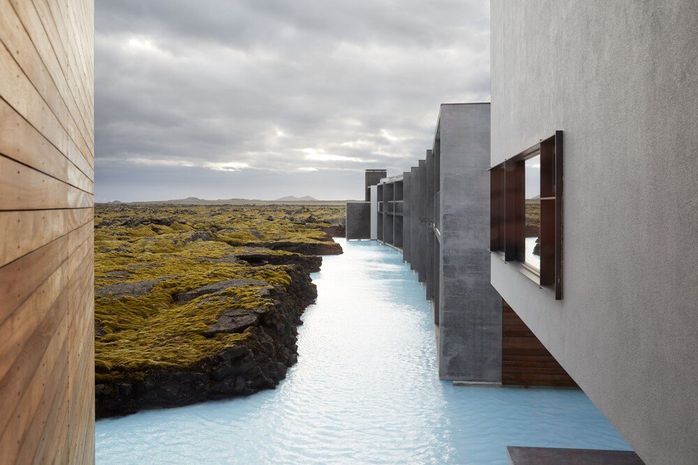 Modern hotel building with a water channel running through it
