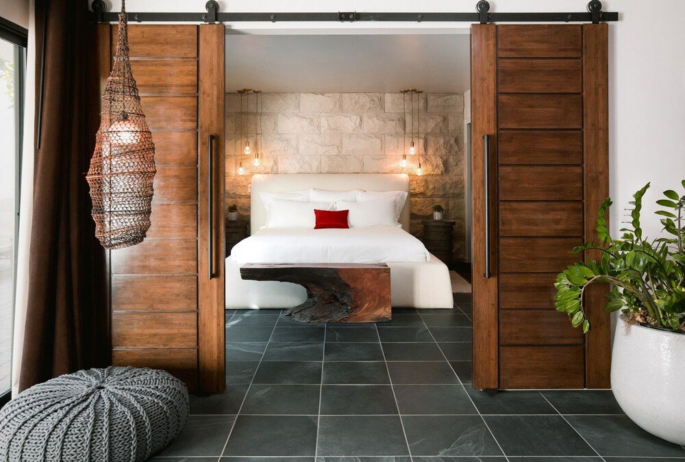 Bedroom with a wooden headboard and soft lighting